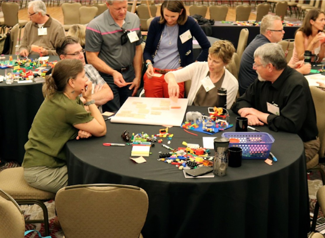 Foresters in discussion around a table